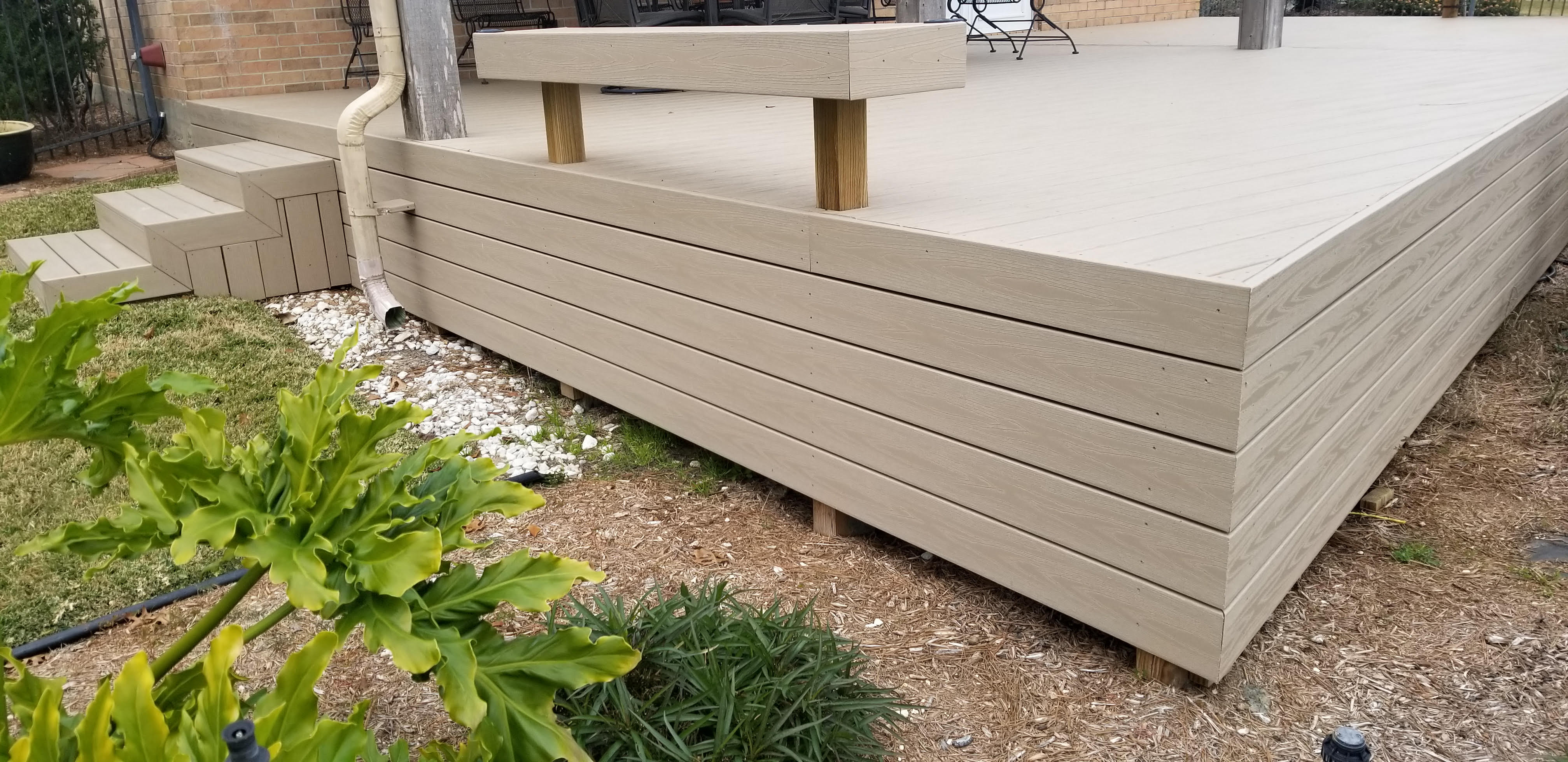 Custom patio skirting and steps built by Cavalier Custom Decks
