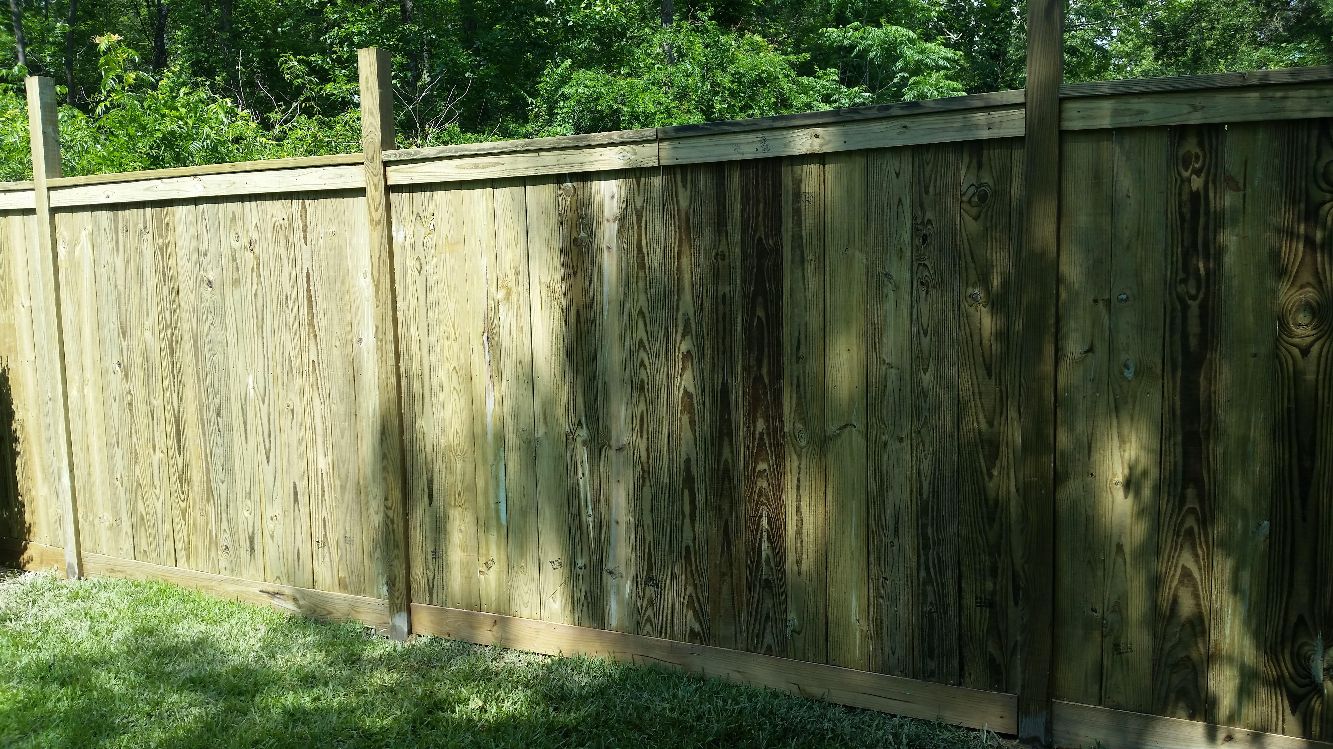 Pressure-treated wood privacy fence installed by Cavalier Custom Decks near Conroe, TX